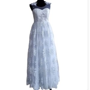 Sleeveless lace overlay full length wedding dress